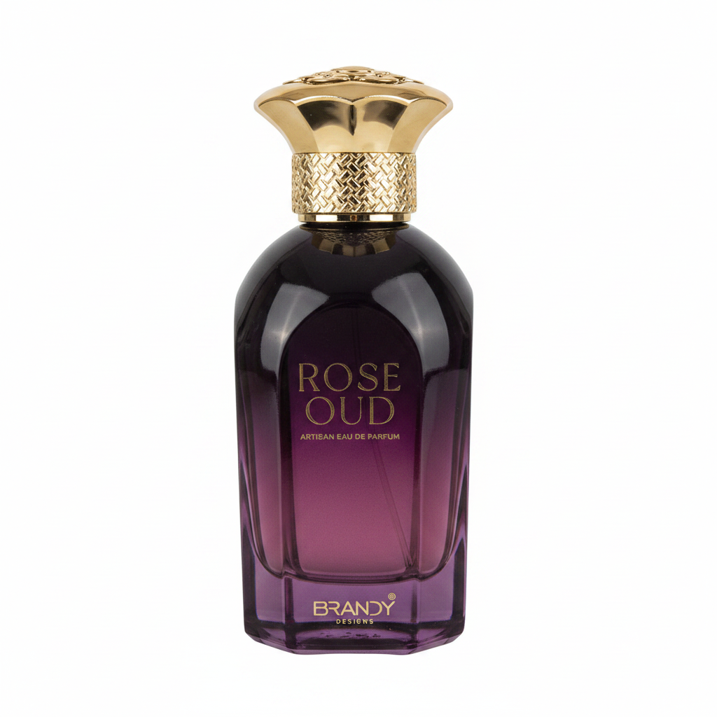 Two bottles of 'Rose Oud' Brandy perfume and its packaging on a stone surface.
