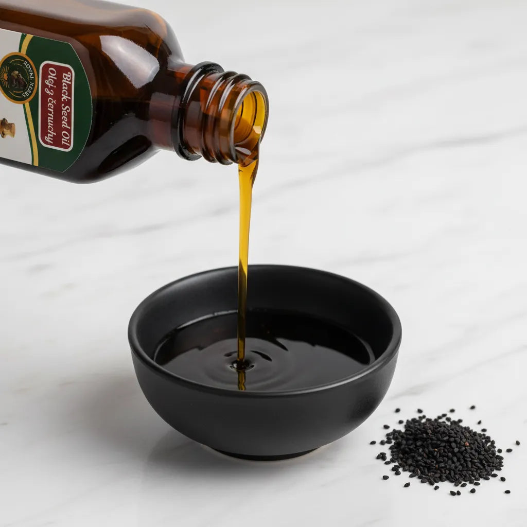 Pure Afghan Blackseed Oil poured into bowl – dark amber cold-pressed kalonji nigella oil 100ml

