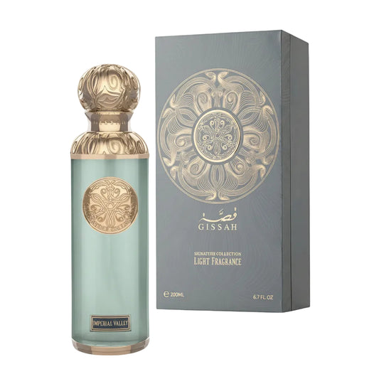 Perfume bottle and packaging with intricate designs on a white background