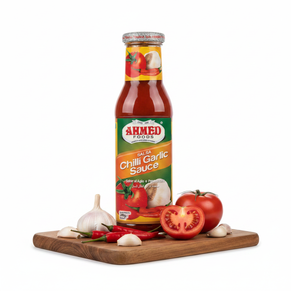 Ahmed Chilli Garlic Sauce 300g – styled hero shot with garlic and red chillies