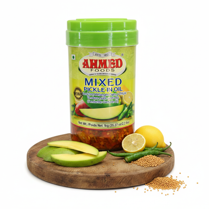 Ahmed Mixed Pickle in Oil 1kg – styled hero shot with mango, chilli and mustard seeds