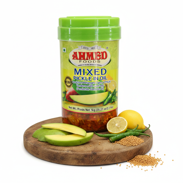 Ahmed Mixed Pickle in Oil 1kg – styled hero shot with mango, chilli and mustard seeds