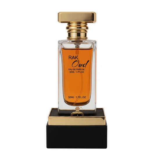 Perfume bottle with gold cap and black base on a white background