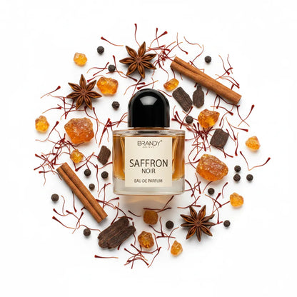 Saffron Noir 100ml flat lay with saffron threads, amber resin and dark wood – Brandy Designs luxury oriental fragrance
