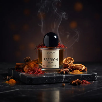 Saffron Noir Eau de Parfum lifestyle shot on dark marble with glowing saffron and amber – Brandy Designs Silk Road oriental luxury fragrance Czech Republic
