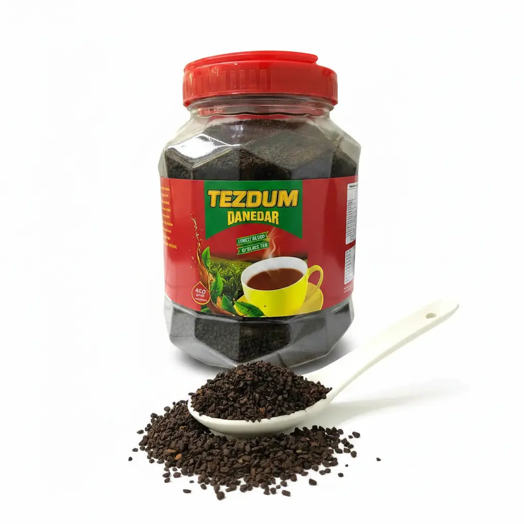 Tezdum Danedar Black Tea 450g granules close-up on ceramic spoon – strong loose granule chai Praha